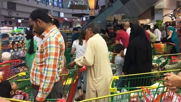 People flocking to supermarkets in Doha to purchase essential commodities. 