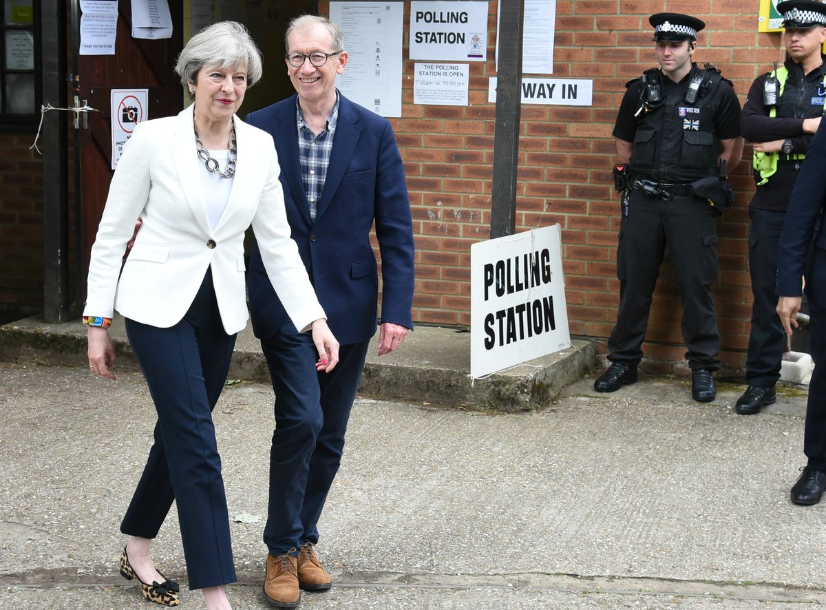 Theresa May and her husband Philip vote at their local polling station in Sonning, Berkshire.