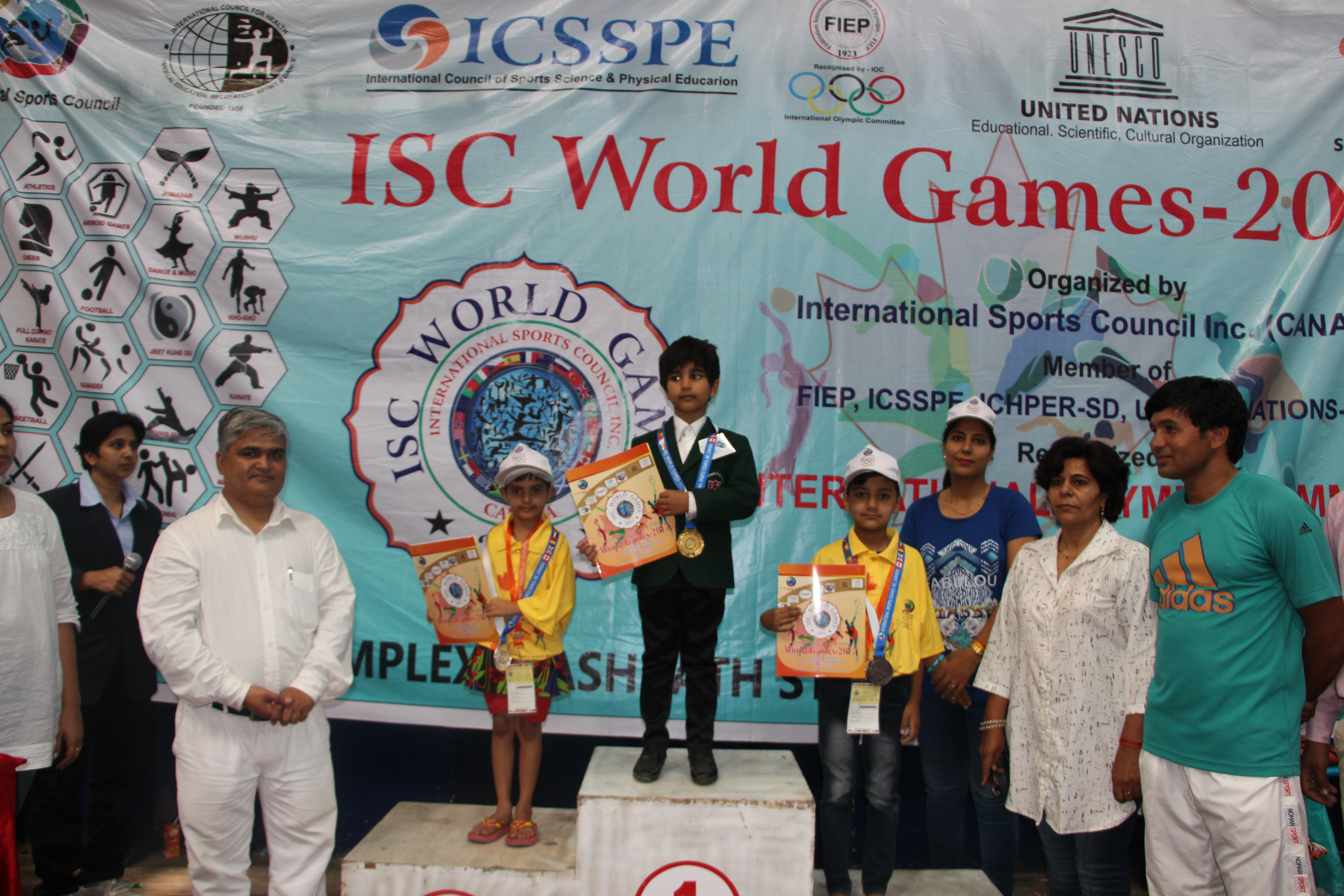 Ishwar on the podium with the gold medal.