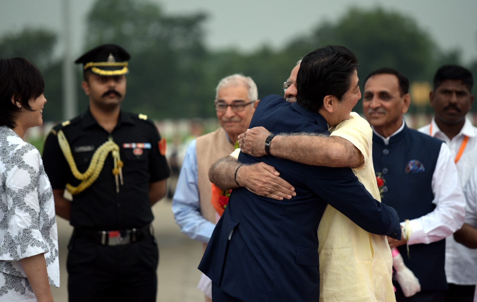 Prime Minister of Japan Shinzo Abe being welcomed by the Prime Minister Narendra Modi, at Ahmedabad airport, Gujarat on September 13, 2017. Mrs Akie Abe(Left) looks on.