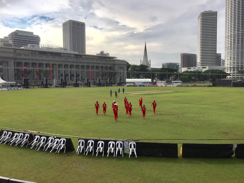 SSC and KCC players take to the field at the Padang. 