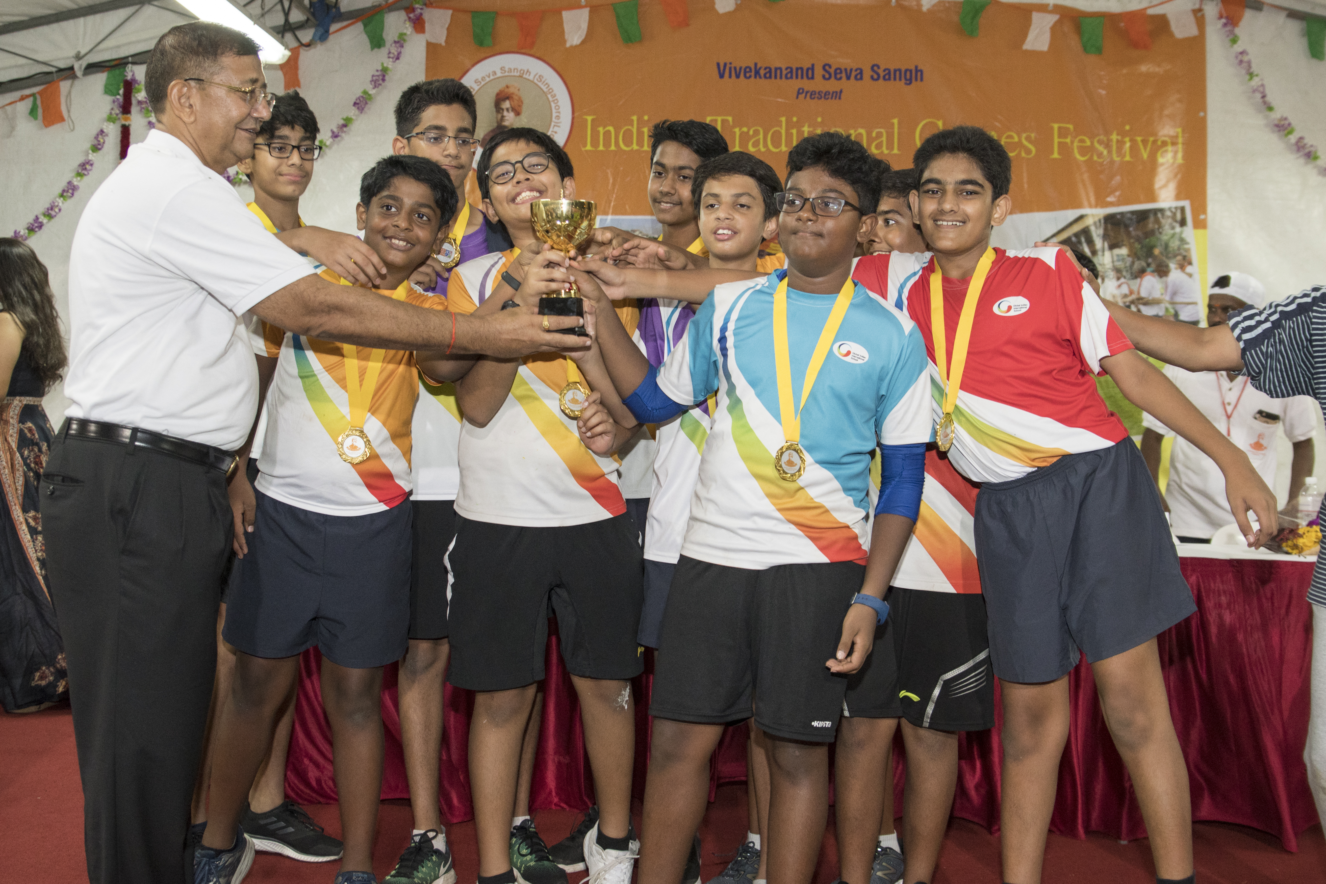 The boys' team cheers after winning.