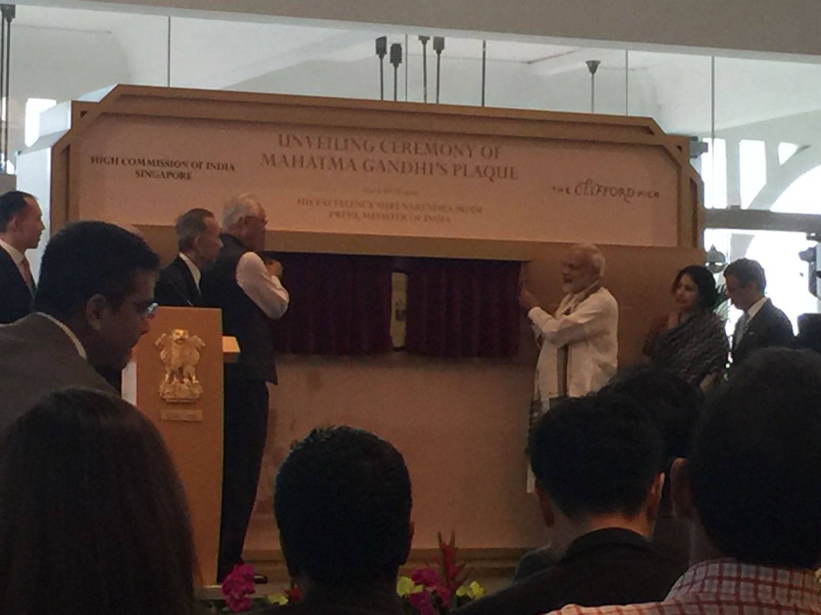 Indian Prime Minister Narendra Modi and former PM of Singapore ESM Goh Chok Tong unveiling a plaque marking the immersion site of Mahatma Gandhi’s ashes at Clifford Pier in Singapore. 