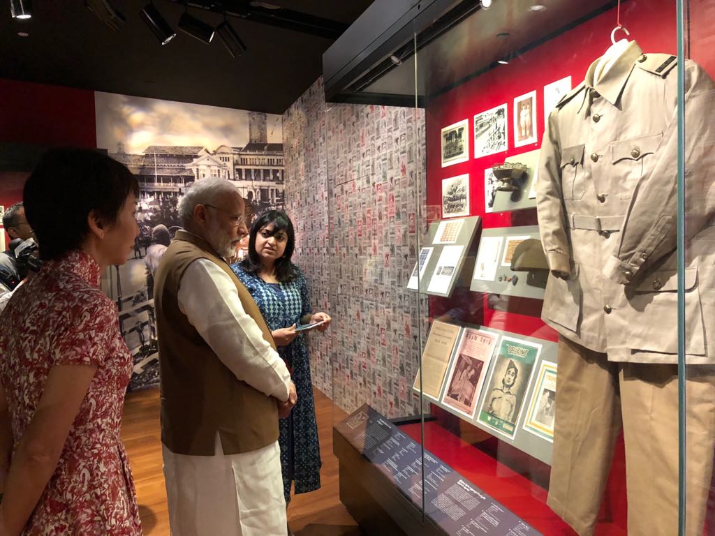 PM Modi seeing various exhibits being displayed at the Indian Heritage Centre. 