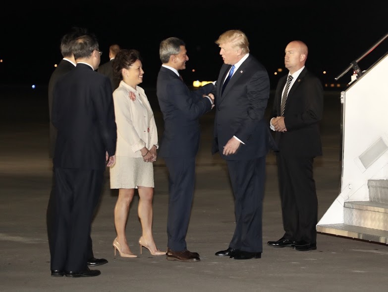 Singapore's Foreign Affairs Minister Dr Vivian Balakrishnan welcoming US President Donald Trump at the Paya Lebar Base as the latter arrives in Singapore to participate in historic summit meeting with North Korean leader Kim Jong Un. Photo courtesy: Ministry of Communications and Information