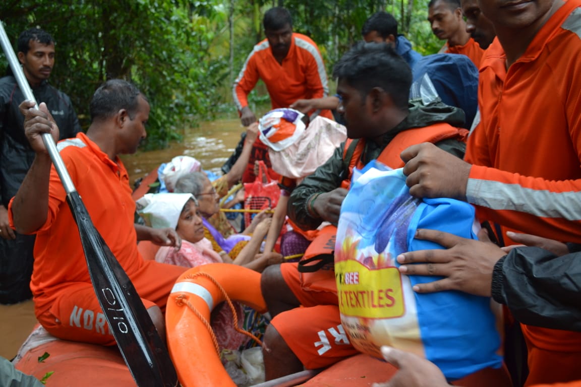 National Disaster Response Force (NDRF) rescuers evacuating people to safer places in Kerala. It is a multi-disciplinary,high-tech specialist force with 12 battalions trained to respond to disasters. Photo courtesy: Twitter/@NDRFHQ