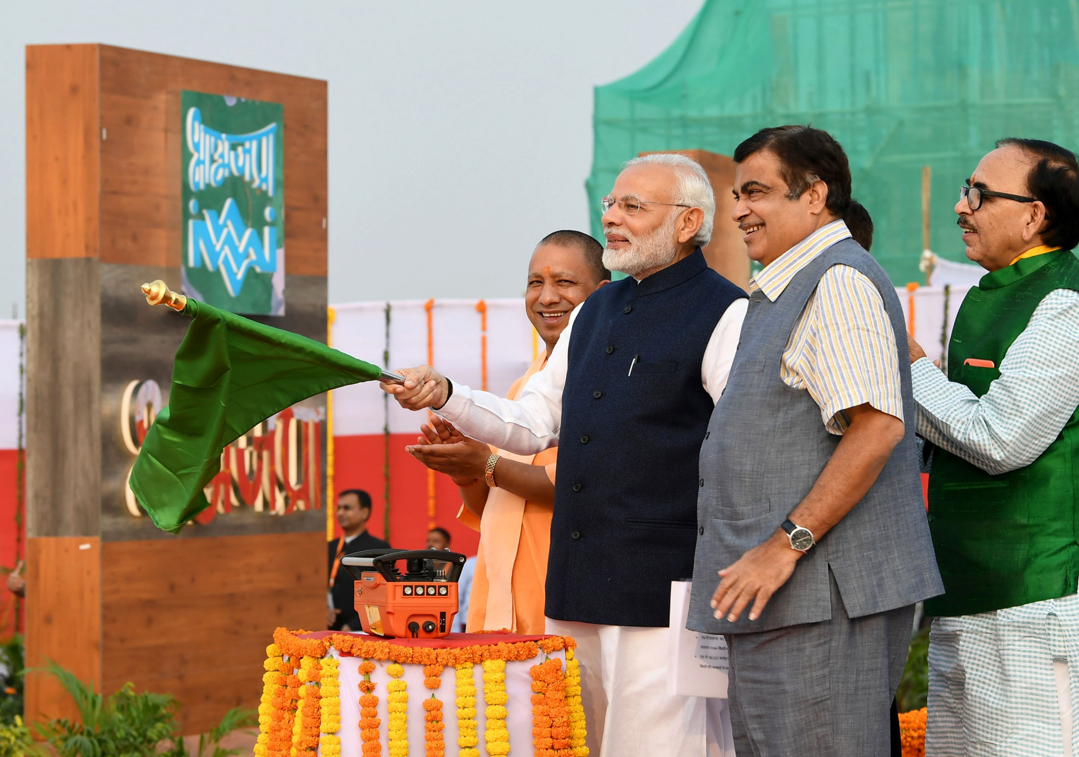 Prime Minister Narendra Modi dedicates the India’s first Multi-Modal Terminal on river Ganga to the nation, in Varanasi, Uttar Pradesh on November 12. Minister for Road Transport & Highways, Shipping and Water Resources, River Development & Ganga Rejuvenation Nitin Gadkari and the Chief Minister of Uttar Pradesh Yogi Adityanath are also seen. Photo courtesy: Press Information Bureau