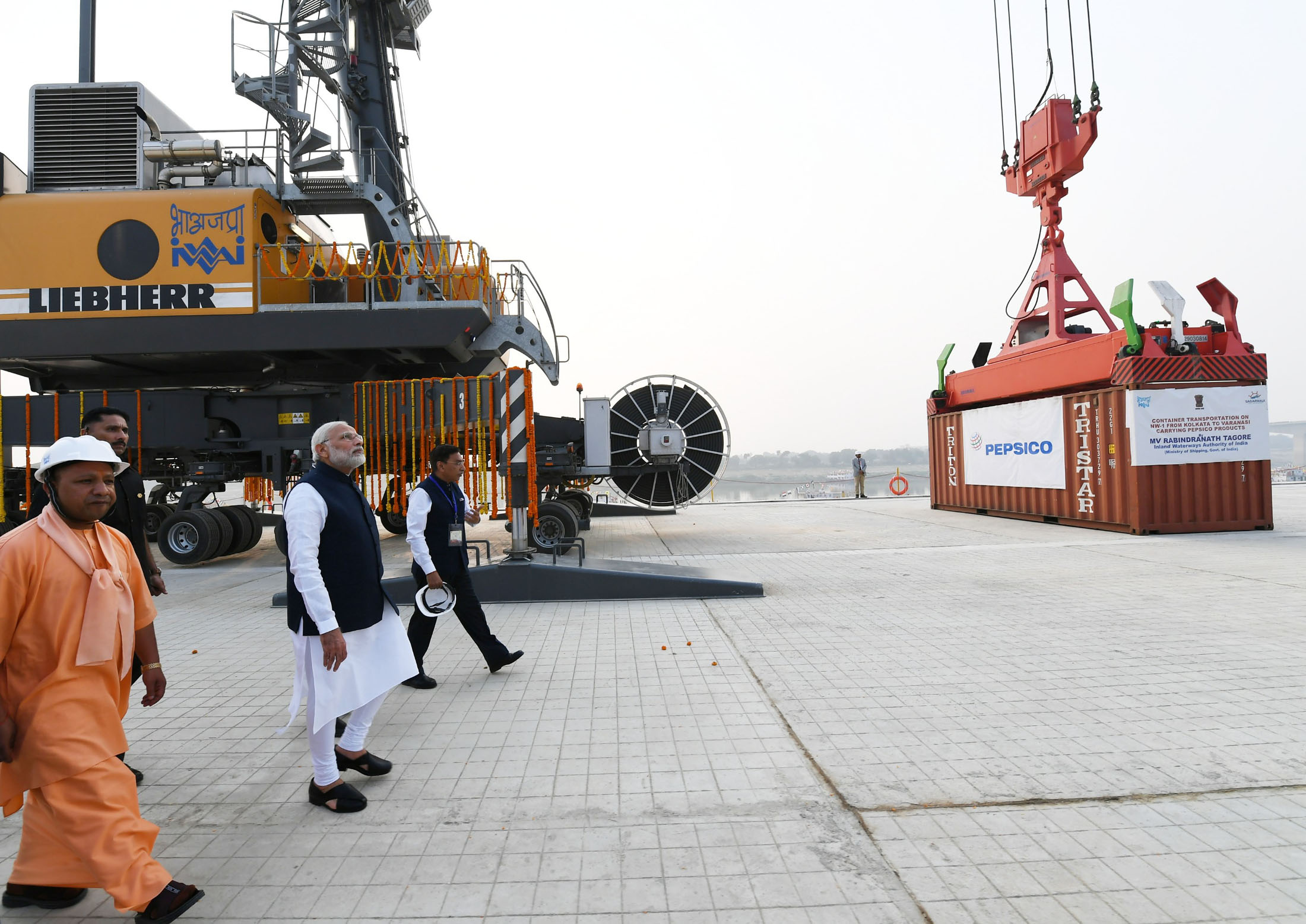 Prime Minister Narendra Modi dedicates the India’s first Multi-Modal Terminal on river Ganga to the nation, in Varanasi, Uttar Pradesh on November 12. Chief Minister of Uttar Pradesh Yogi Adityanath are also seen. Photo courtesy: Press Information Bureau