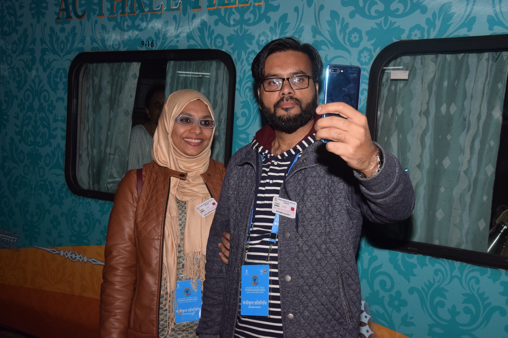 NRI couple taking selfie at Allahabad junction to preserve their memory about their rich experience at Kumbh Mela. Photo: Connected to India