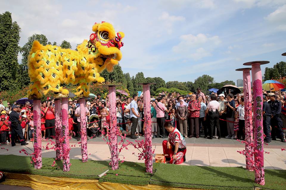 People enjoying the Lion Dance performance by the Yi Wei Athletic Association during the Chinese New Year Istana Open House. Photo courtesy: Facebook page of President Halimah