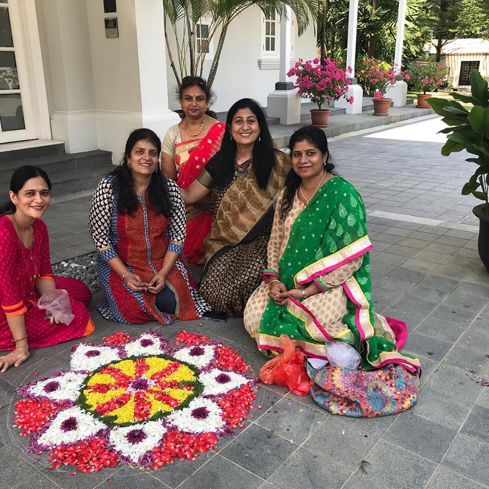 A beautiful flower rangoli art on the floor of the India house.  Photo courtesy: IDF, Singapore