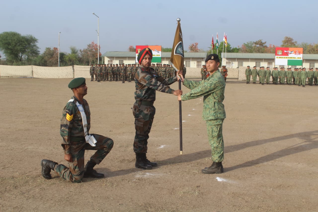   Handing over of ceremonial flag taking place at the opening ceremony of India-Singapore joint army exercise at Babina Military station near Jhansi in the Indian State of Uttar Pradesh. Photo courtesy: Ministry of Defence, India