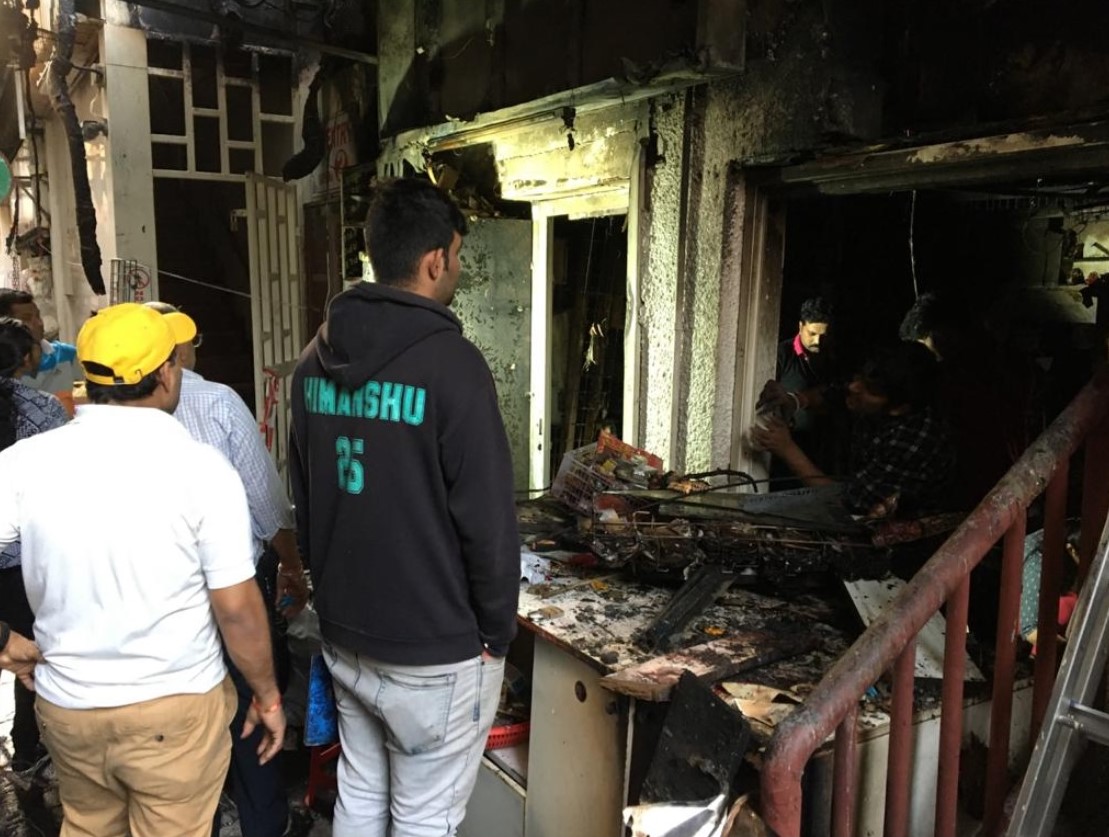 The fire started in two small novelty stores in a small alley located right next to the staircase leading up to the temple, which is on the first floor