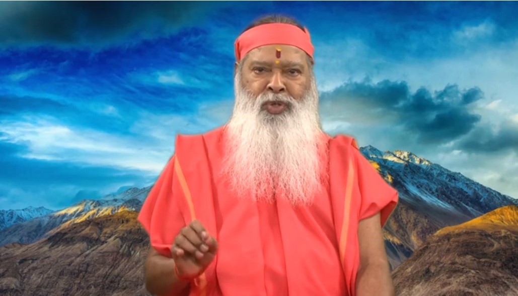 Indian spiritual guru, Sri Ganapathi Sachidananda Swamiji, wrote the lyrics and also recites them at the beginning of this musical video. Photo Courtesy: Screenshot of video