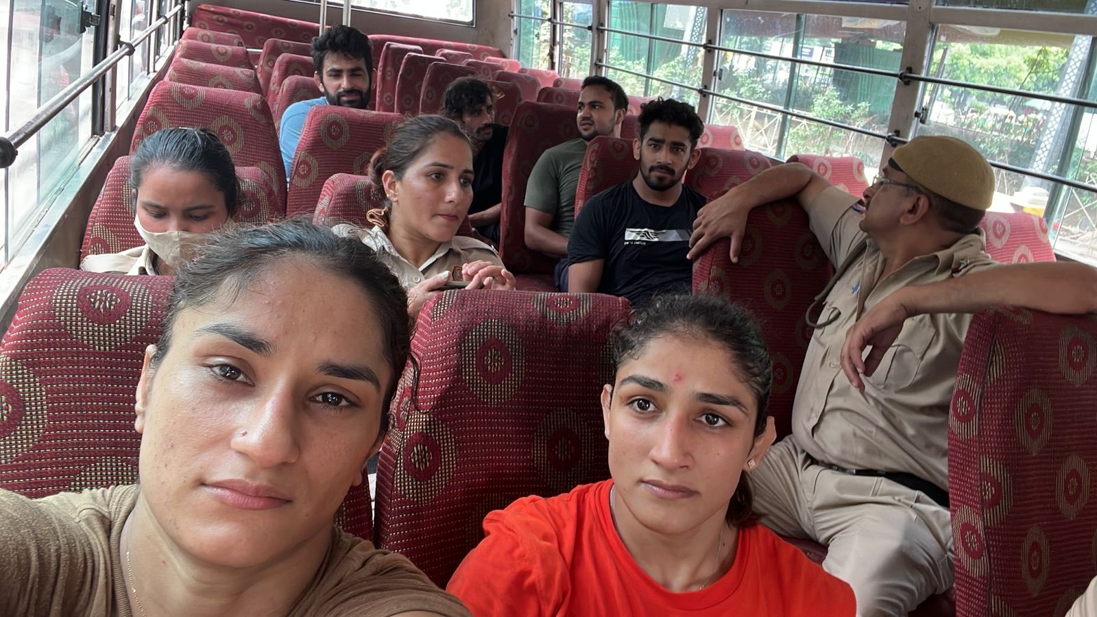 Protesting wrestlers Vinesh Phogat (left) and Sangita Phogat in police custody. Photo courtesy Twitter/@VineshPhogat